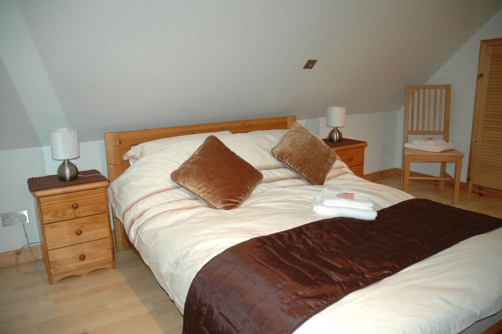 Spacious bedroom with LCD TV
